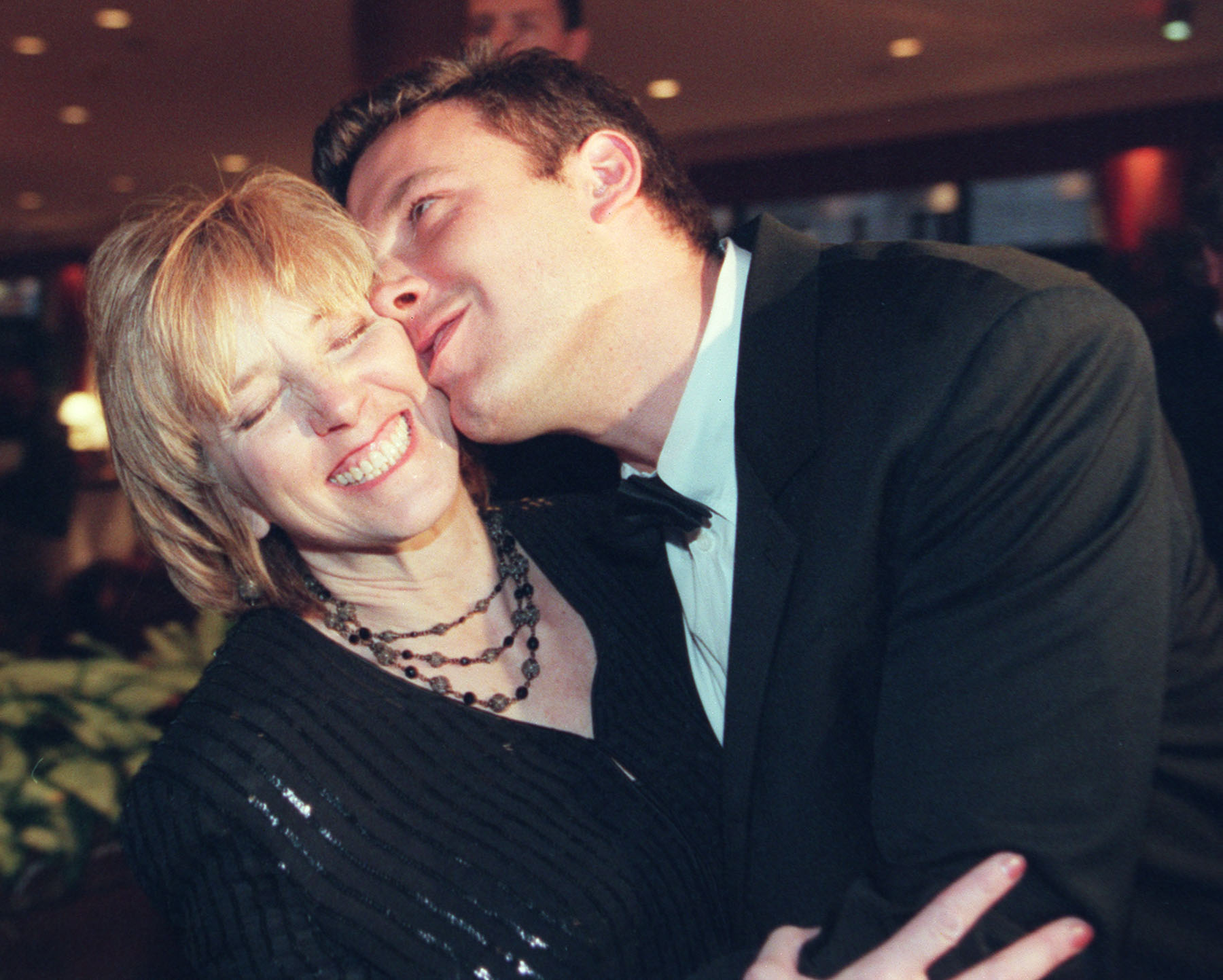 Ben Affleck kisses his mother Chris Affleck at the Westin Hotel during the MSPCC celebration of the 12th annual "Family Affair" on November 12, 2010. | Source: Getty Images