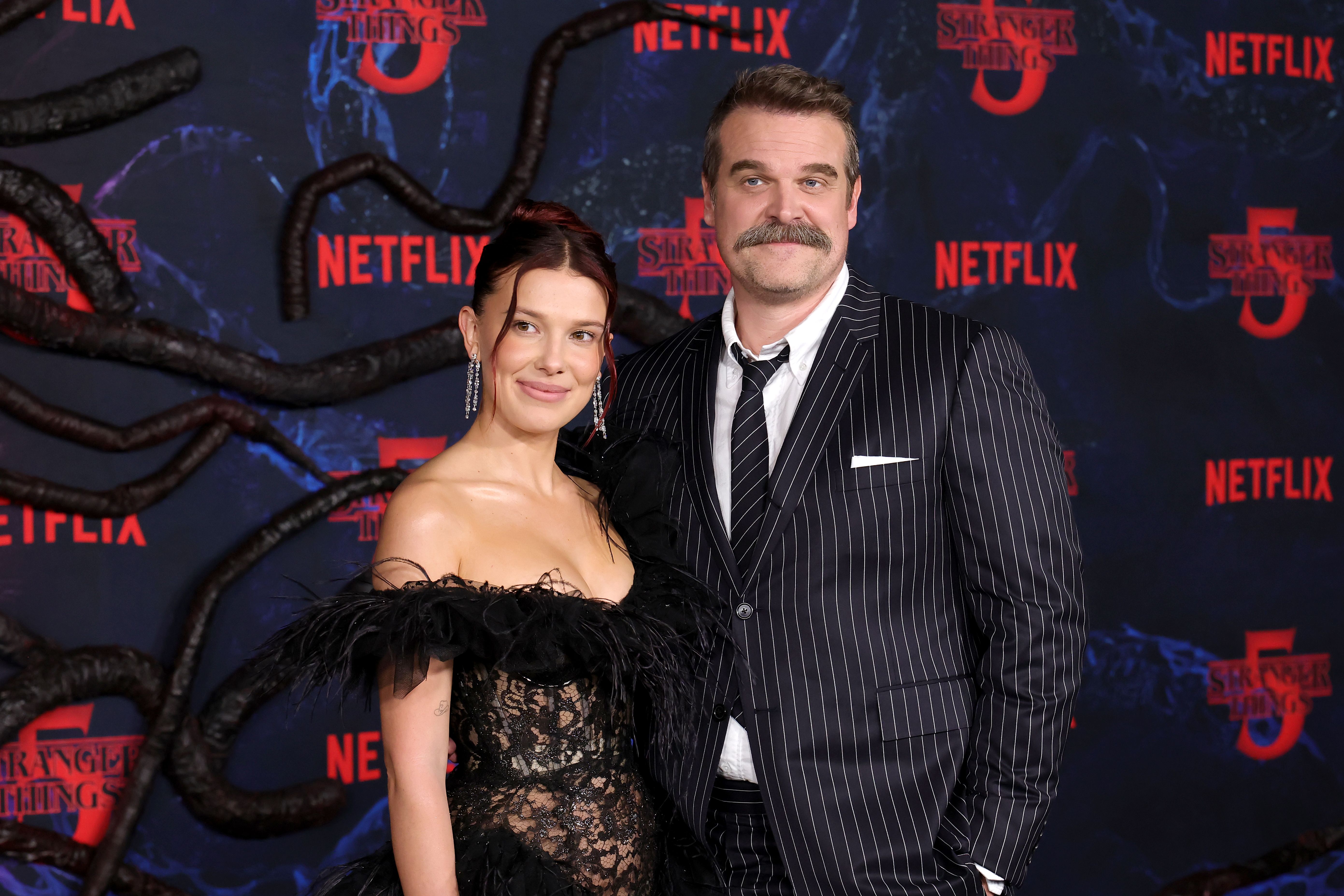 Millie Bobby Brown and David Harbour attend the Los Angeles Premiere of Netflix's "Stranger Things" Season 5 at TCL Chinese 6 Theatres on November 6, 2025 in Hollywood, California. | Source: Getty Images