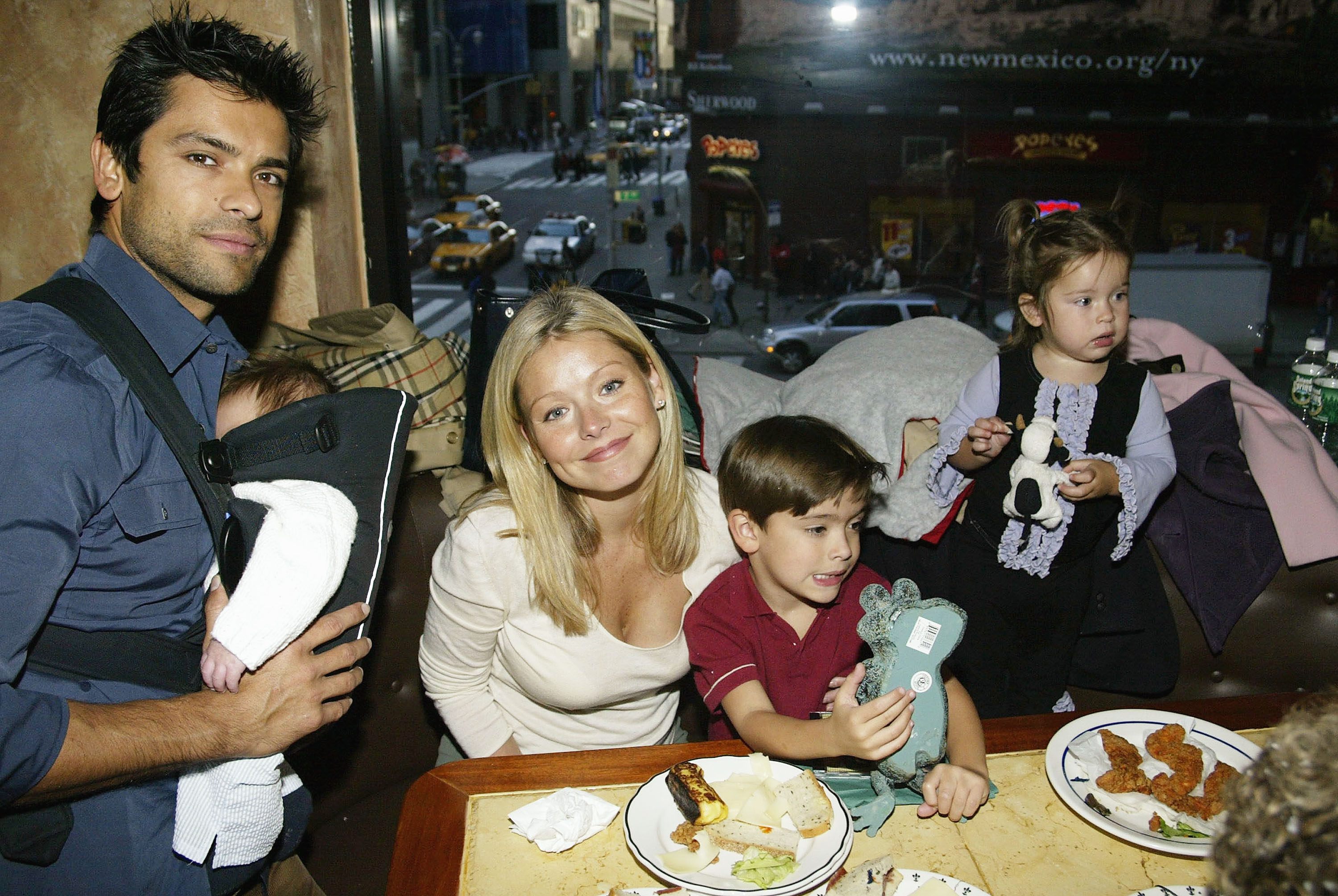 Kelly Ripa and Mark Consuelos attend an event with their three children in 2003. The photo captures the family during the early years, when Michael, Lola, and Joaquin were all still young children. | Source: Getty Images