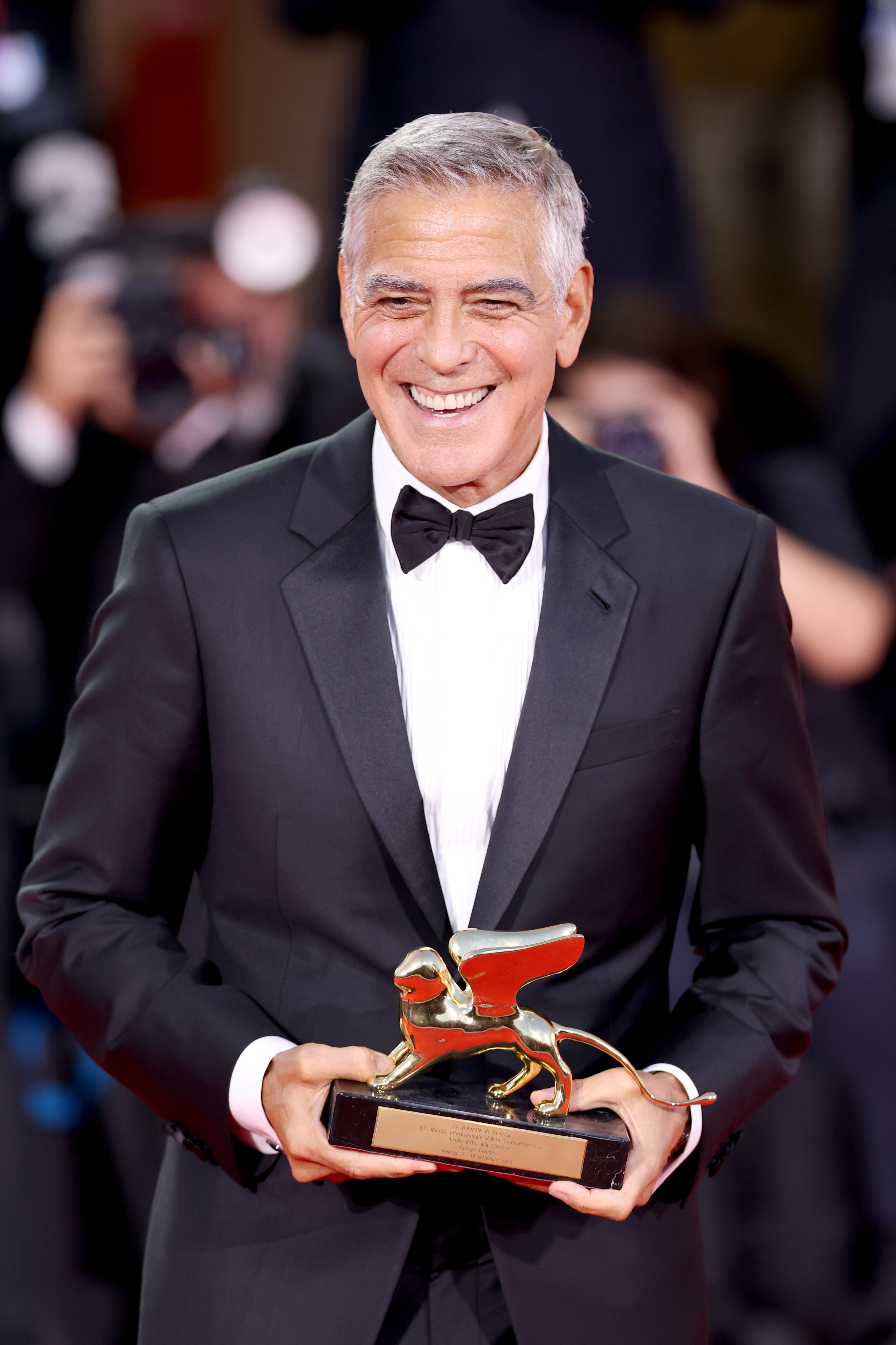 George Clooney poses on the red carpet after receiving the Golden Lion for Lifetime Achievement Award during the Opening Ceremony the 83rd Venice International Film Festival at Sala Grande on September 2 in Venice, Italy. | Source: Getty Images