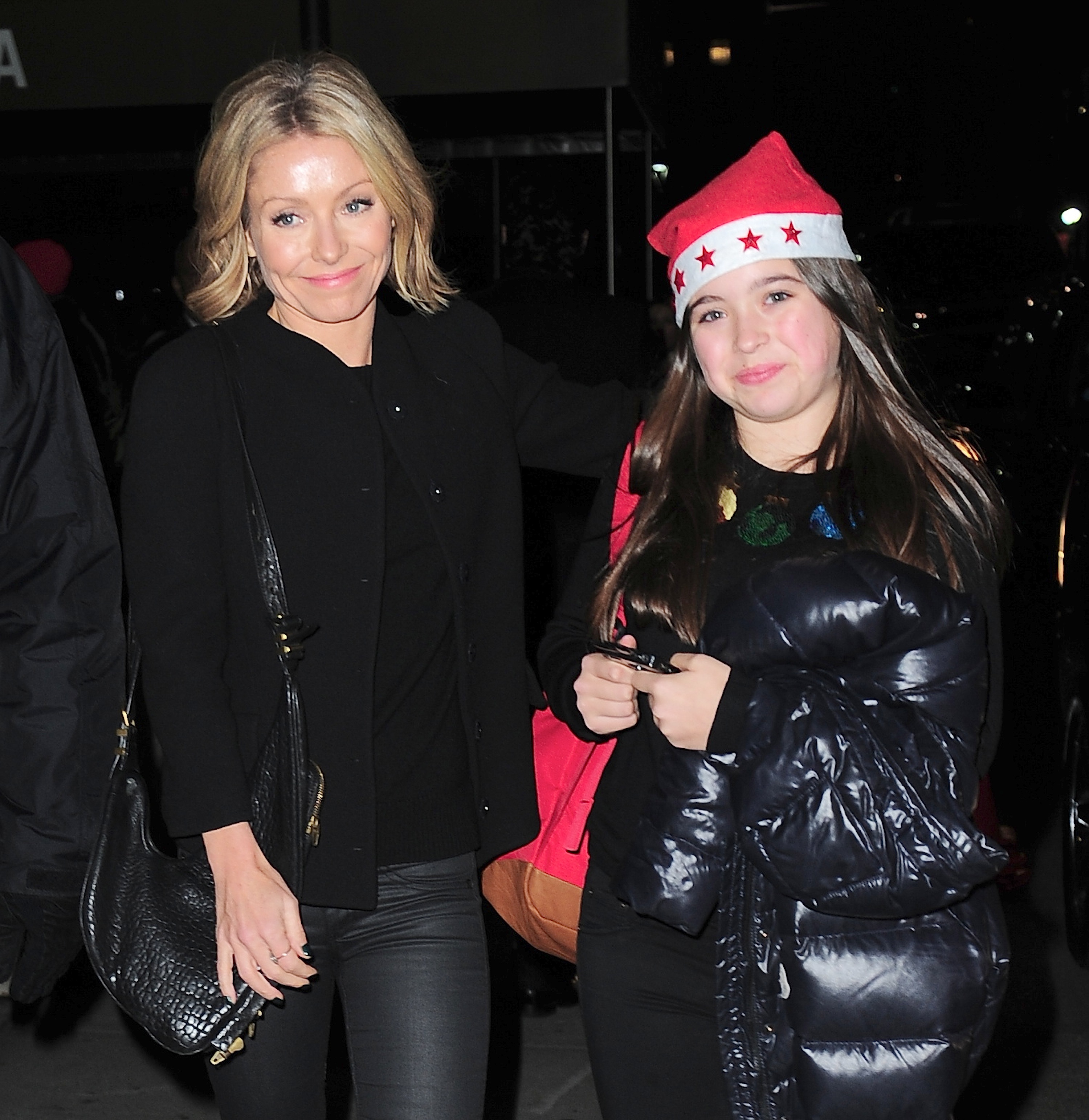Kelly Ripa and Lola Consuelos pose together in New York City in 2013. The image captures Lola years before she launched her music career and began making public appearances on her own. | Source: Getty Images