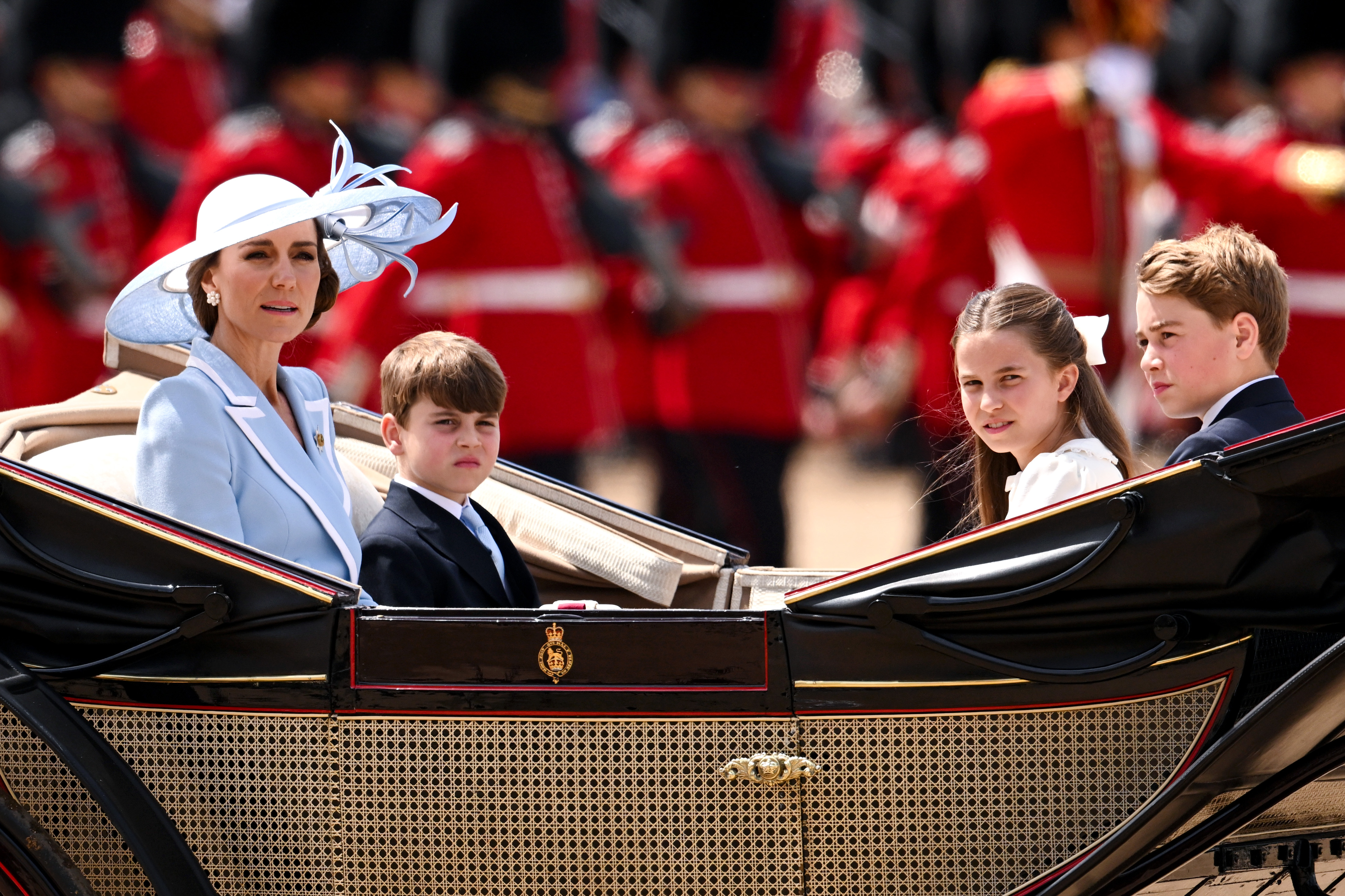 Catherine, Princess of Wales, Prince Louis of Wales, Princess Charlotte of Wales and Prince George of Wales travel by carriage during Trooping The Colour 2026 on June 13 in London, England. | Source: Getty Images