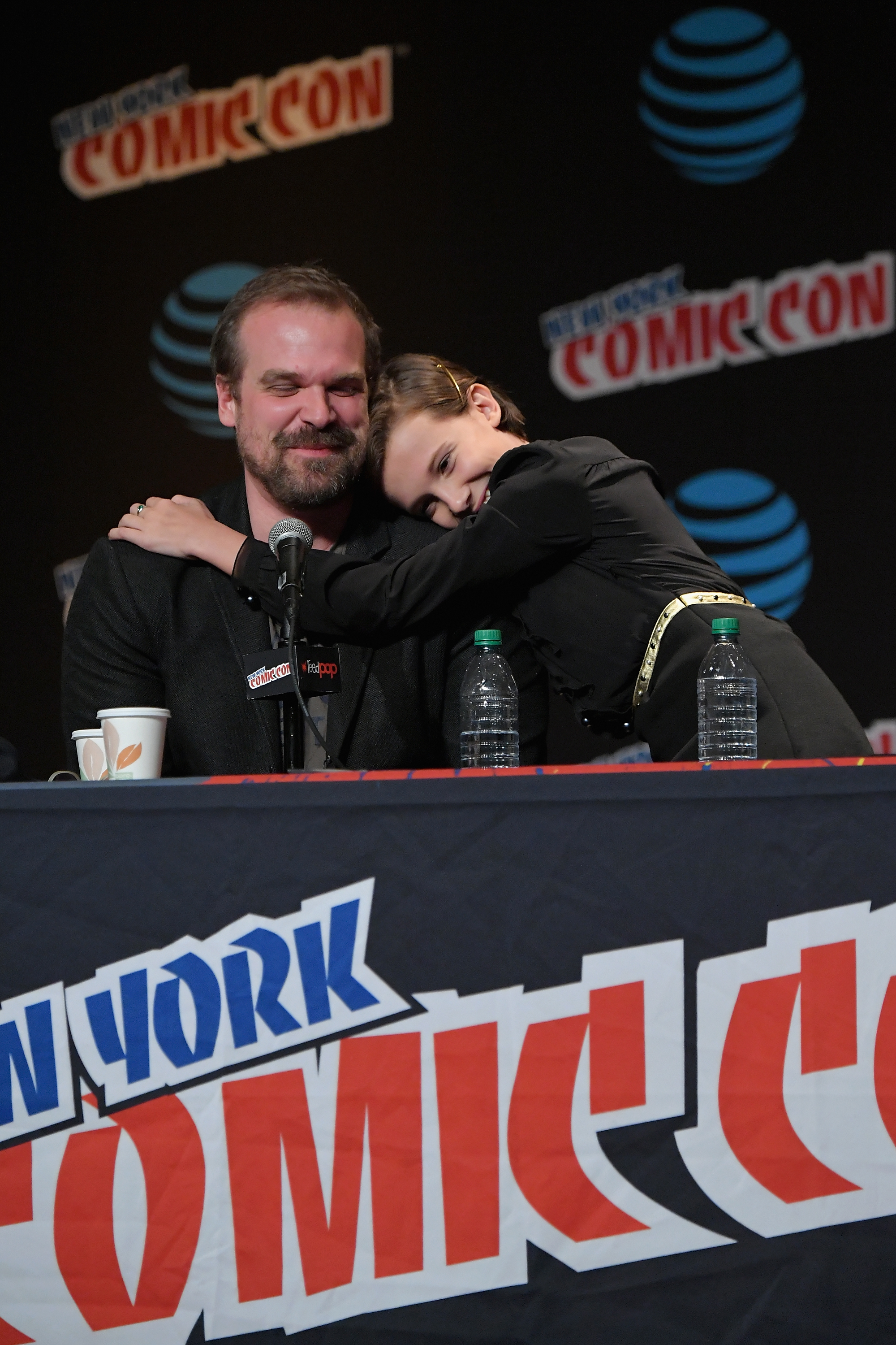 David Harbour and Millie Bobby Brown speak onstage at Inside the Upside Down with Millie Bobby Brown and David Harbour at Jacob Javits Center on October 7, 2016 in New York City. | Source: Getty Images