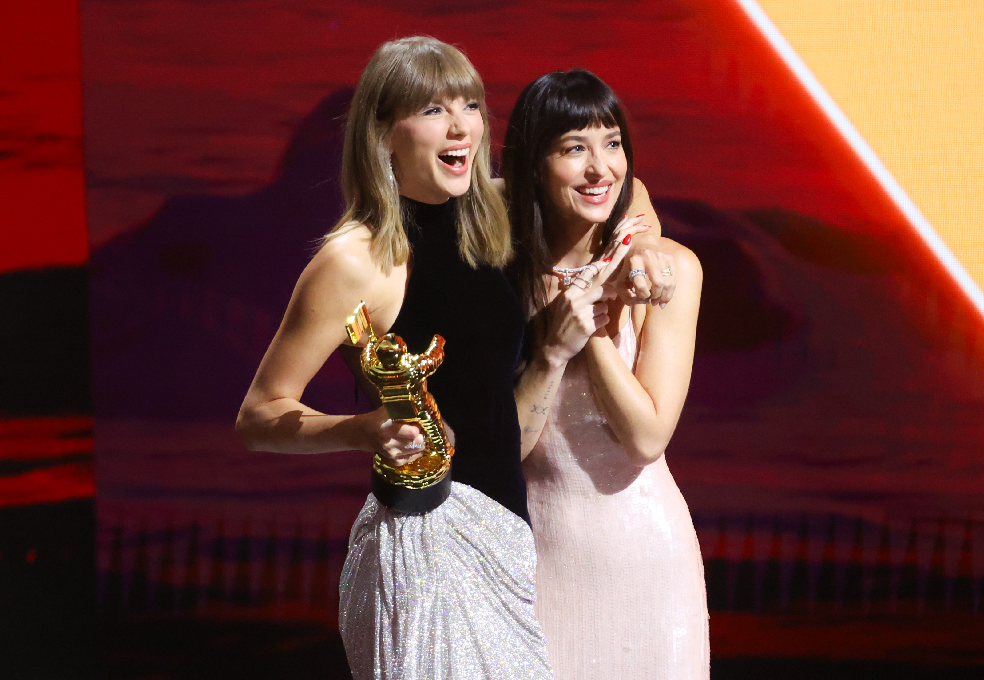 Taylor Swift and Dakota Johnson onstage as Swift accepts the Artist Director Honors at the 2026 MTV Video Music Awards held at Peacock Theater on September 27 in Los Angeles, California. | Source: Getty Images