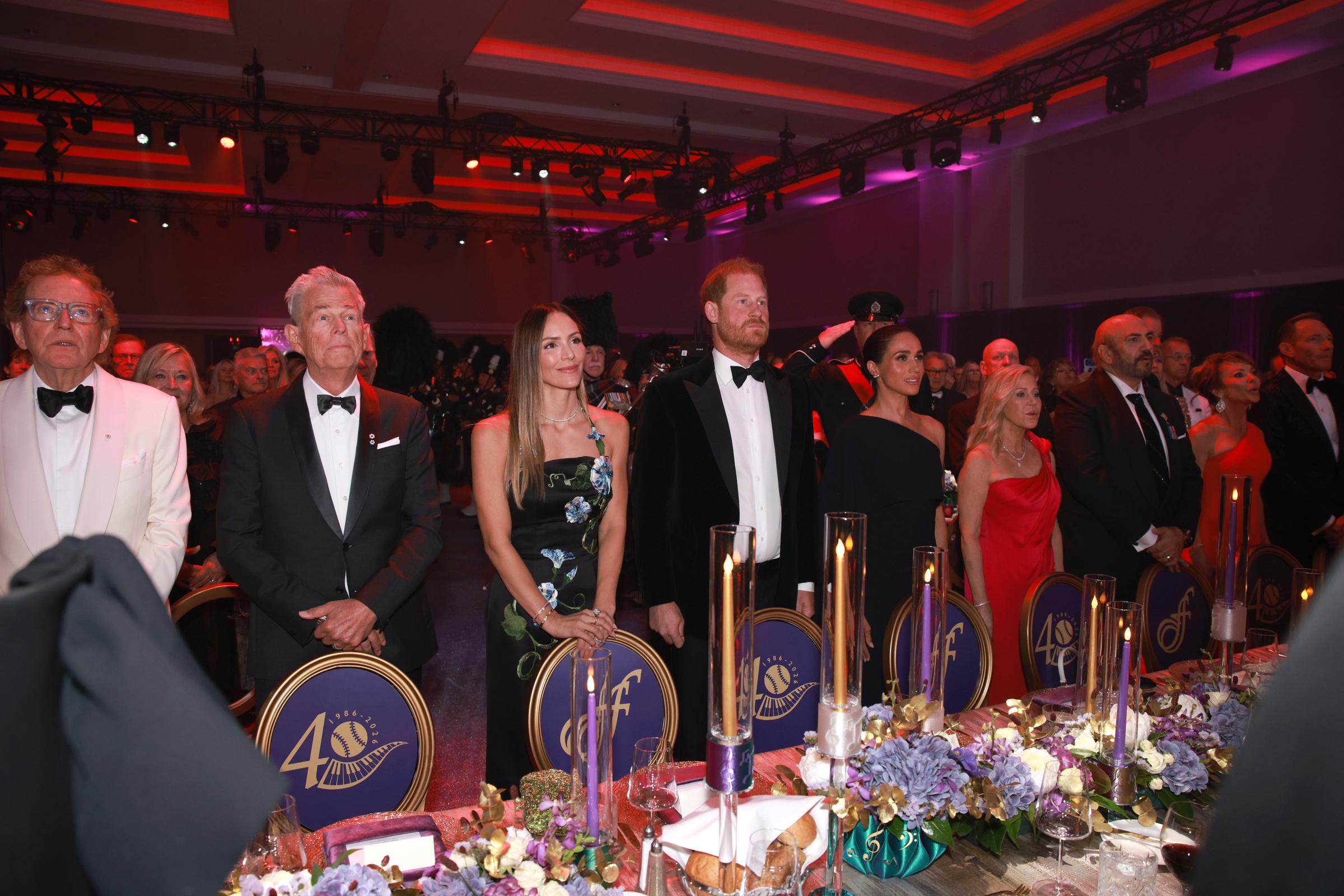 (L-R) Anthony von Mandl, David Foster, Katharine McPhee, Prince Harry, Duke of Sussex, Meghan, Duchess of Sussex, The Honourable Wendy Cocchia and Sergio Cocchia attend the David Foster Foundation 40th Anniversary Celebration on August 7, 2026 in Victoria, British Columbia. | Source: Getty Images