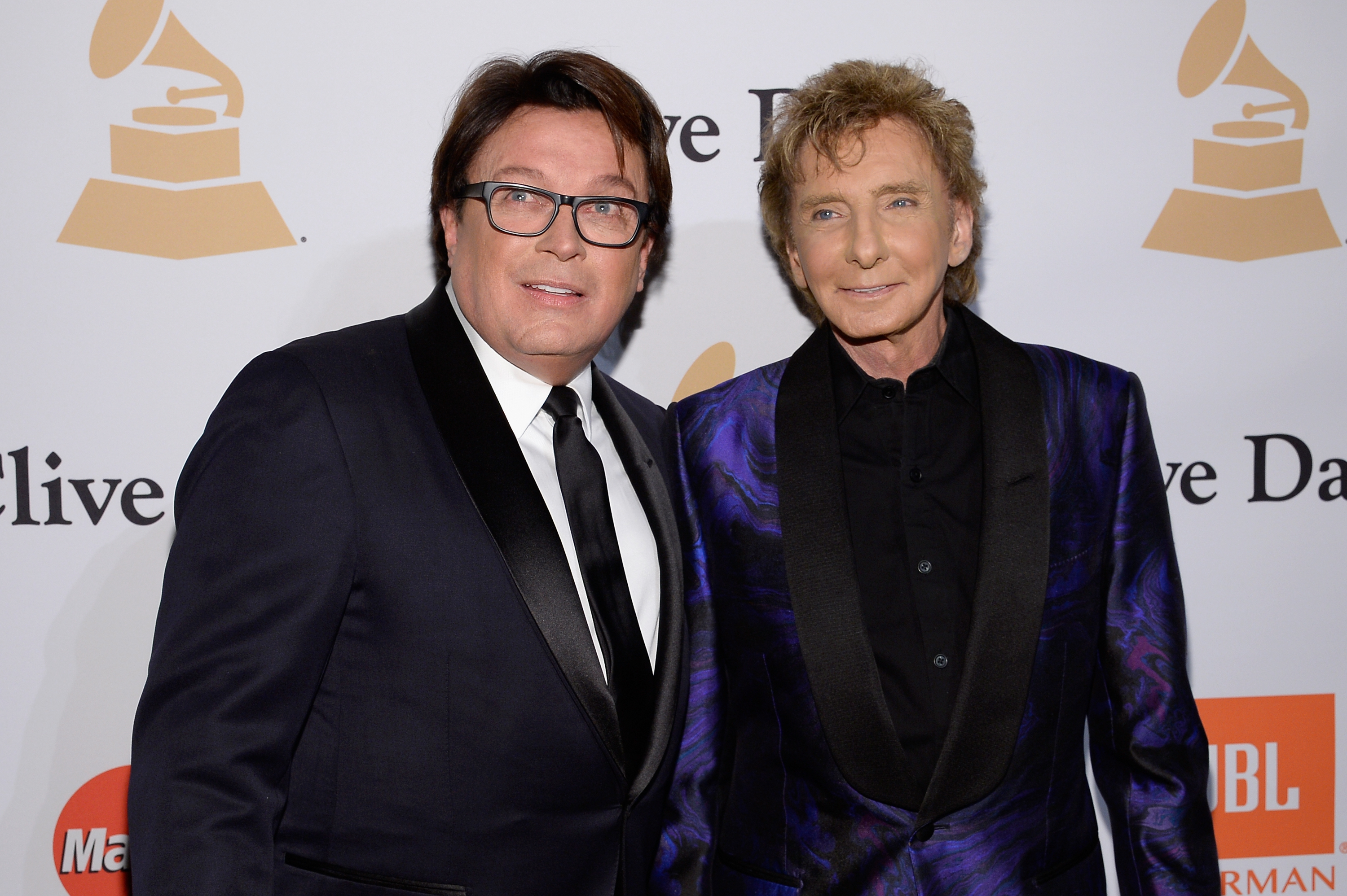Garry Kief (L) and singer Barry Manilow attend the 2016 Pre-GRAMMY Gala and Salute to Industry Icons honoring Irving Azoff at The Beverly Hilton Hotel on February 14, 2016 in Beverly Hills, California. | Source: Getty Images
