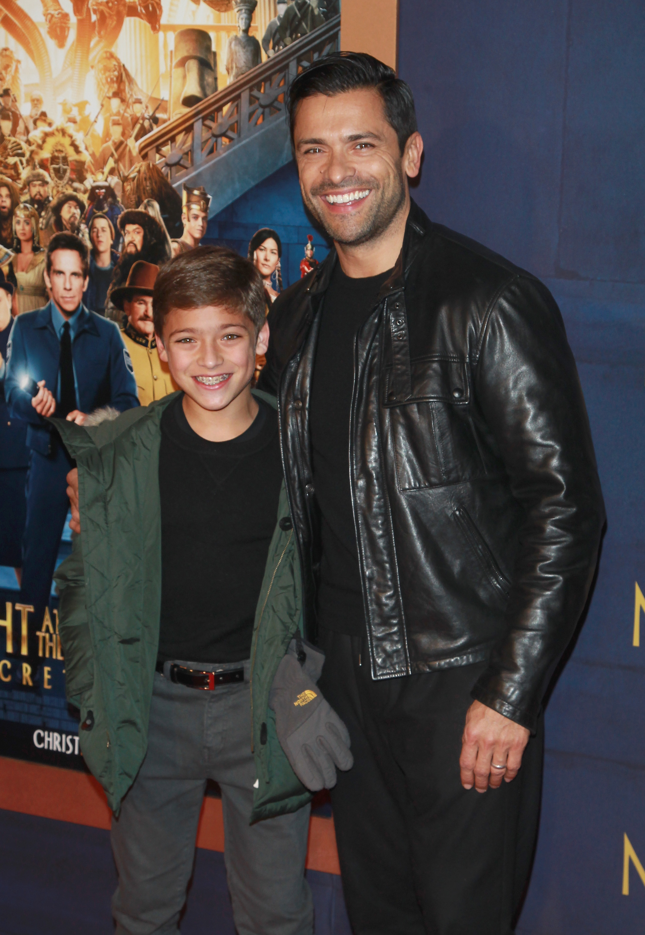 Joaquin Consuelos and Mark Consuelos attend the New York premiere of "Night at the Museum: Secret of the Tomb" in 2014. The photo captures Joaquin during his childhood, years before his college wrestling career began. | Source: Getty Images