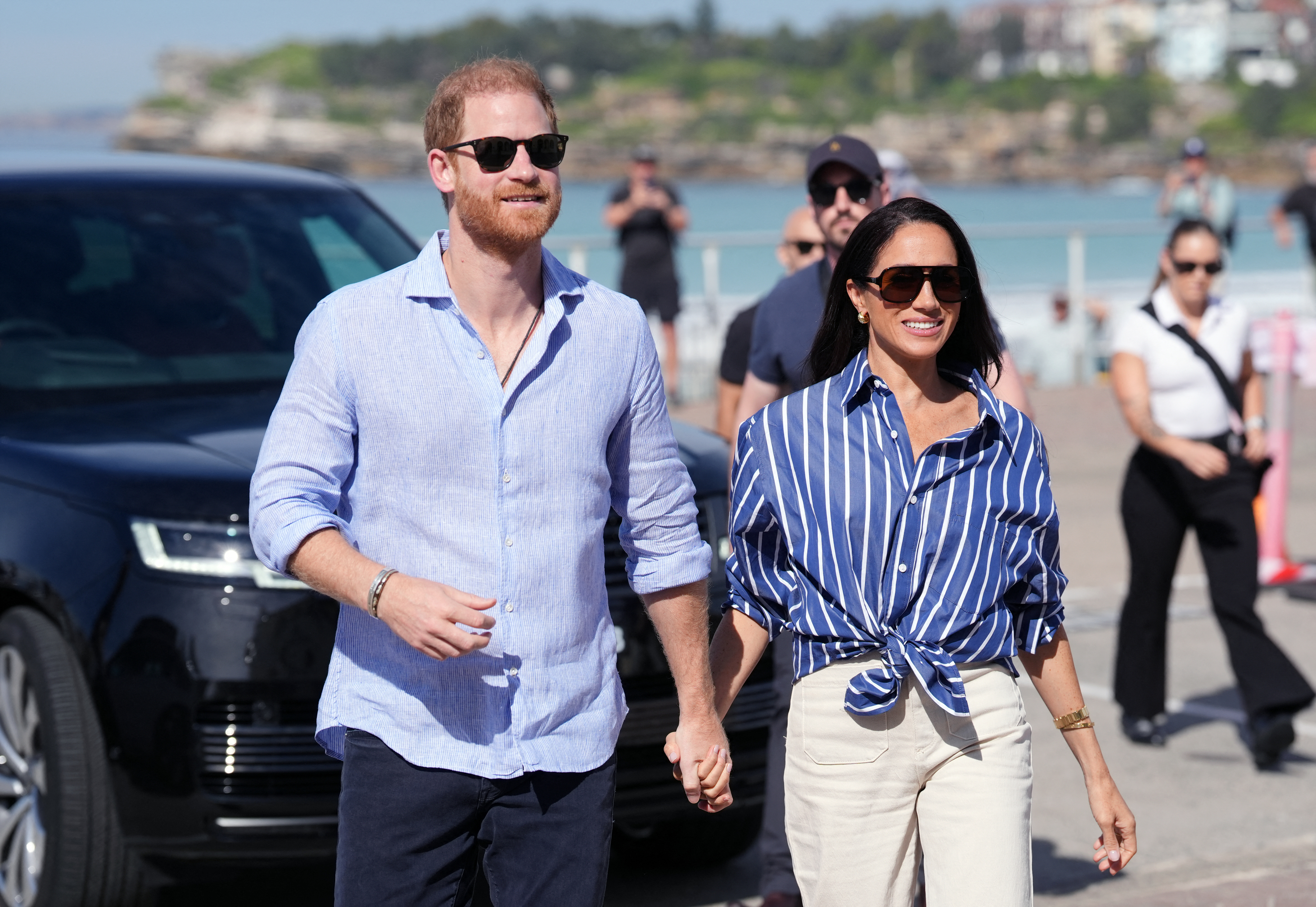 Prince Harry, Duke of Sussex, and his wife Meghan, the Duchess of Sussex, arrive to meet with volunteer first responders from Bondi Surf Bathers' Life Saving Club at Bondi Beach on April 17, 2026 in Sydney, Australia. | Source: Getty Images