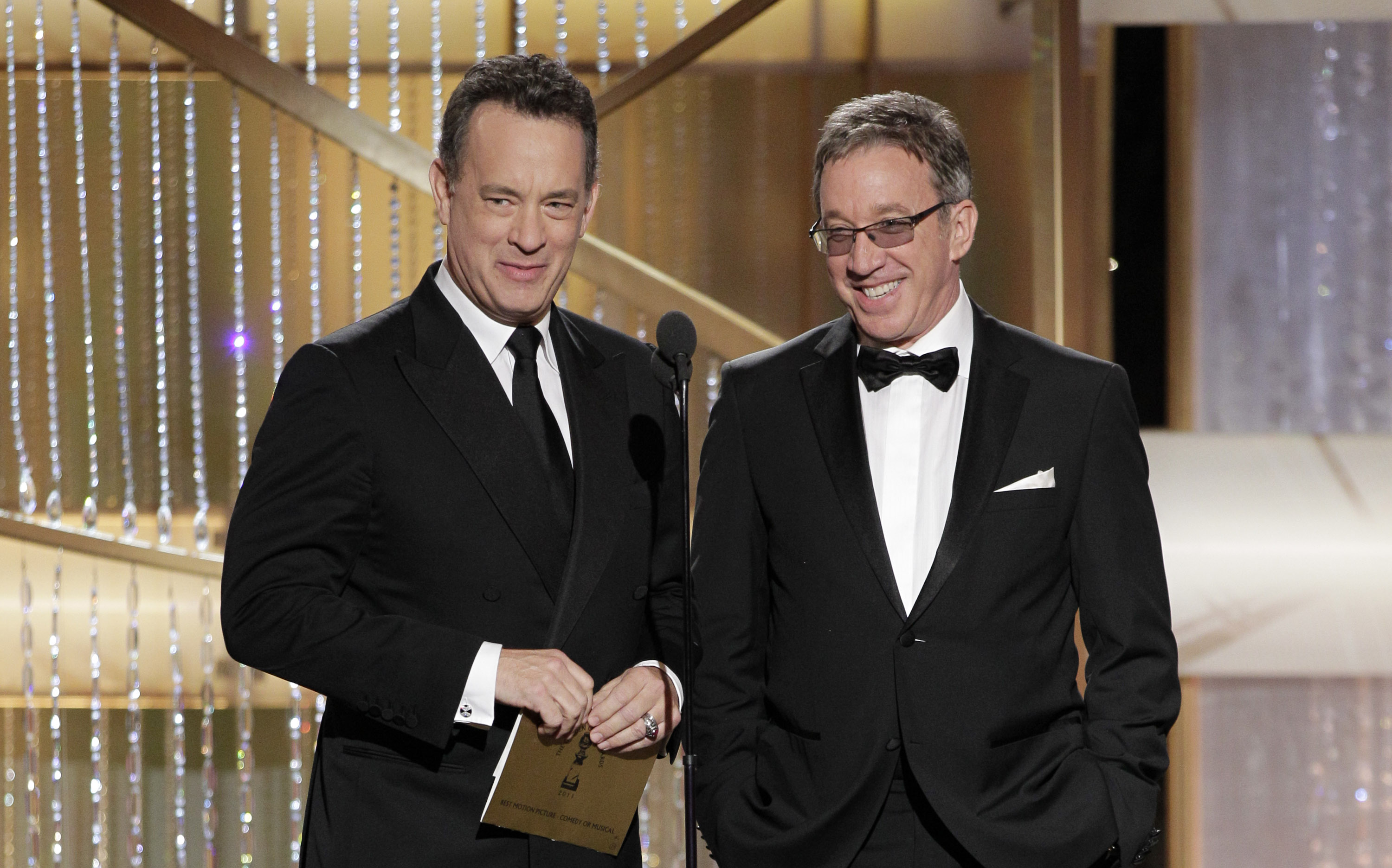 Tom Hanks and Tim Allen on stage during the 68th Annual Golden Globe Awards held at the Beverly Hilton Hotel on January 16, 2011. | Source: Getty Images