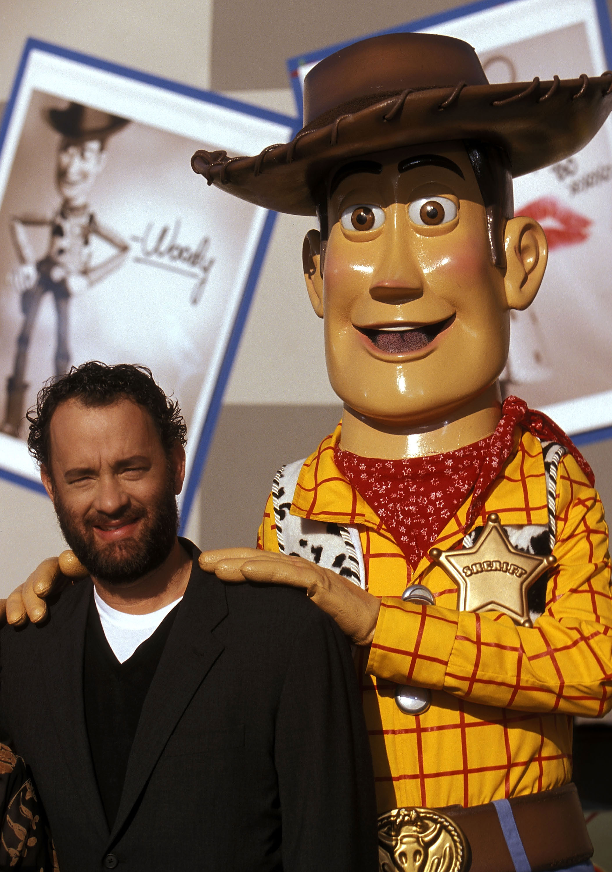 Tom Hanks and Woody attend the "Toy Story 2" Themed NASCAR Racing Cars Unveiling at the El Capitan Theatre on October 23, 1999 in Hollywood, California. | Source: Getty Images