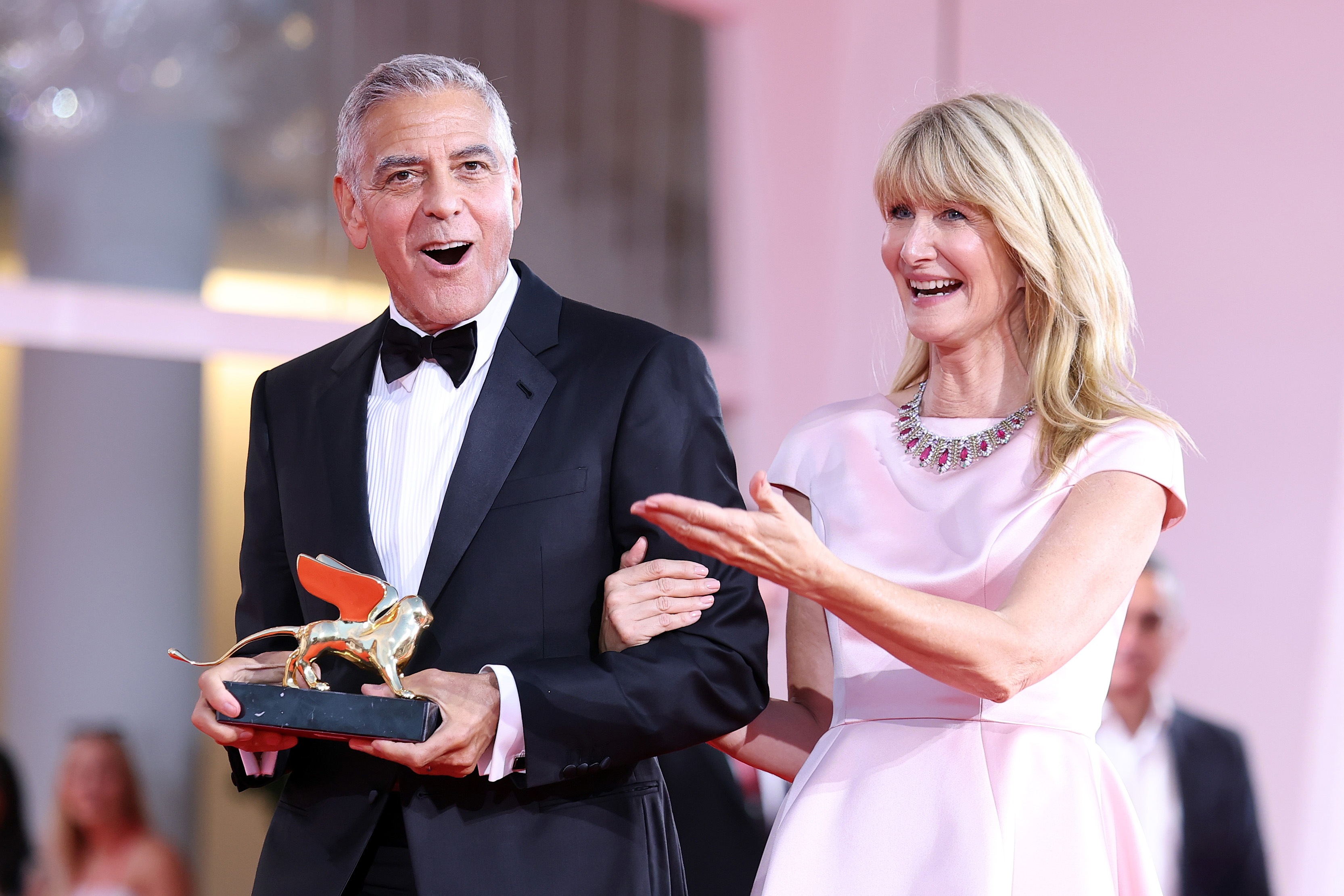 George Clooney poses on the red carpet with Laura Dern after receiving the Golden Lion for Lifetime Achievement Award during the Opening Ceremony the 83rd Venice International Film Festival at Sala Grande on September 2 in Venice, Italy. | Source: Getty Images
