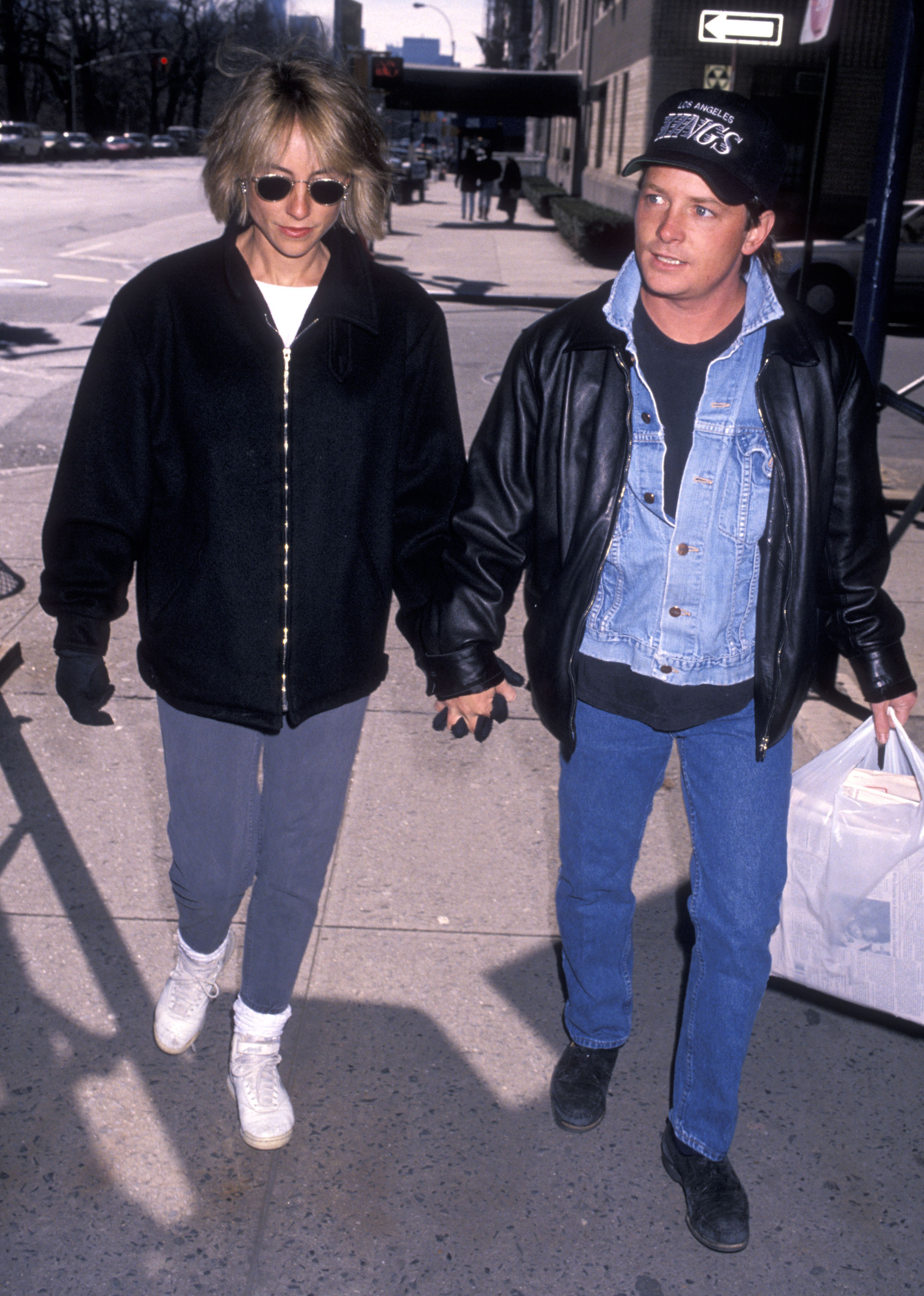 Taken on February 18, 1990, this candid snapshot offers a rare glimpse into the couple's everyday, grounded life away from the Hollywood flashbulbs. At this moment, they were navigating life as new parents to their less-than-a-year-old son, Sam.