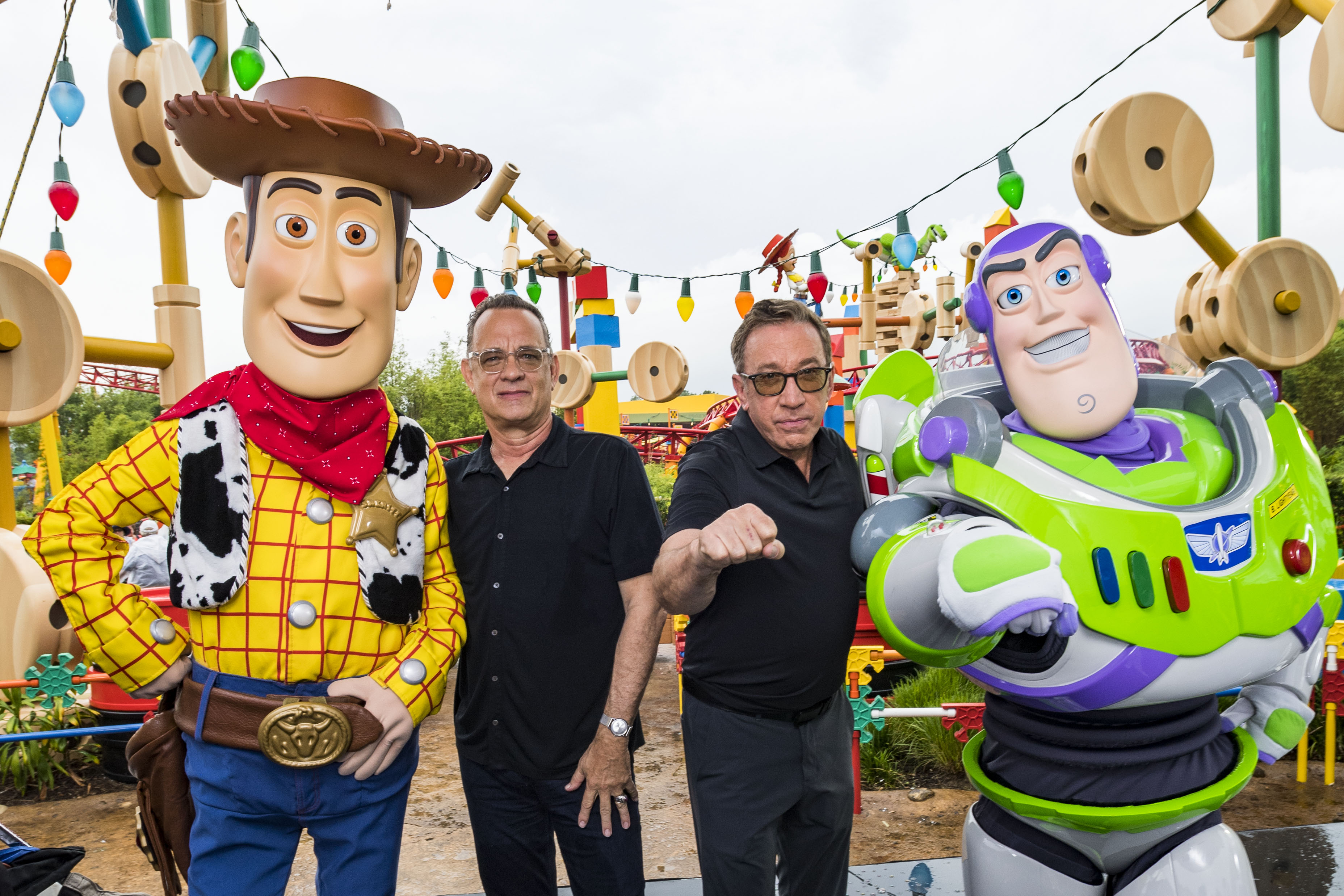 Tom Hanks and Tim Allen appear with characters Woody and Buzz Lightyear from the film inside Toy Story Land at Disney's Hollywood Studios at Walt Disney World Resort on June 8, 2019 in Lake Buena Vista, Florida. | Source: Getty Images