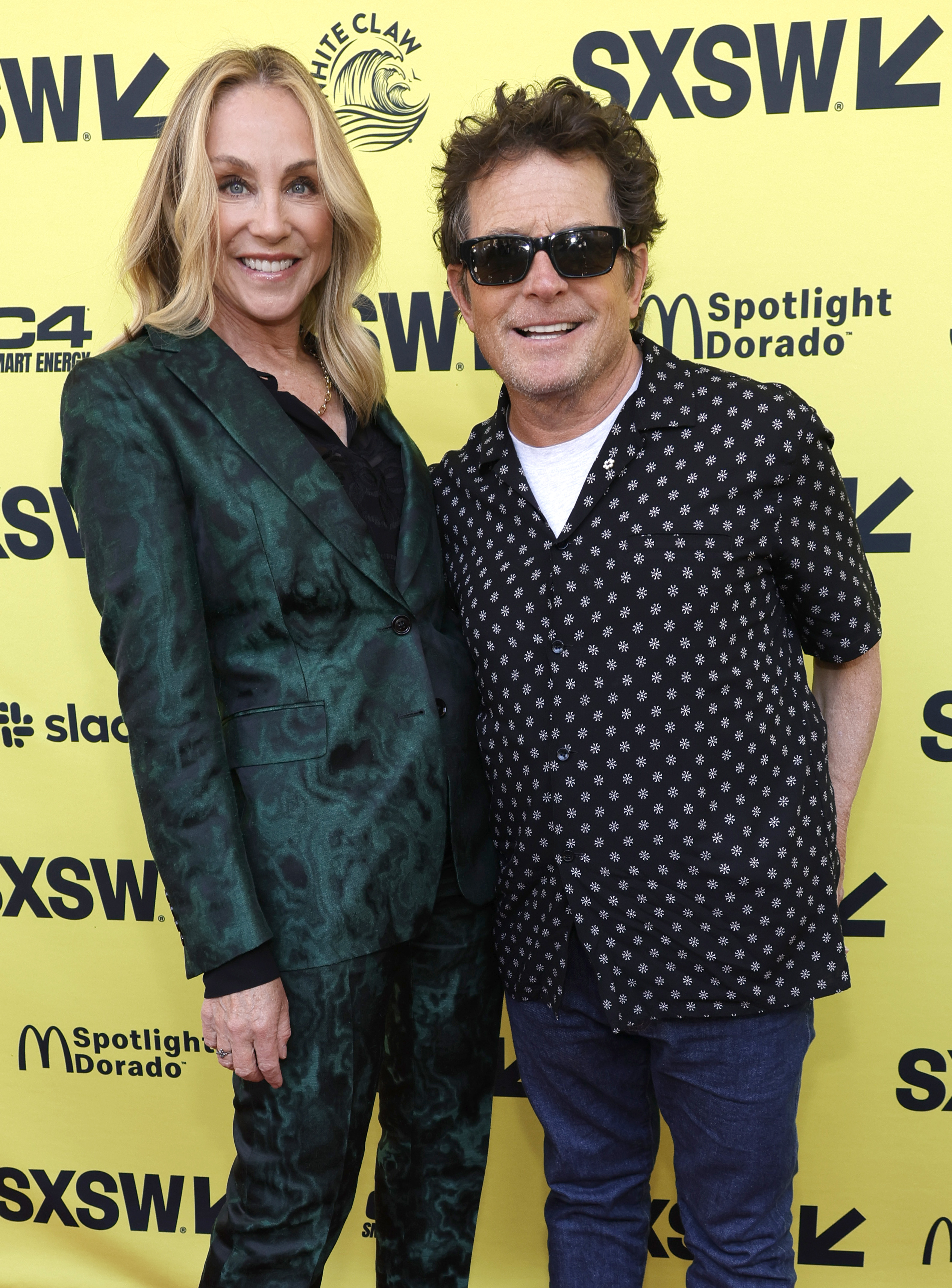 Exuding confidence on the vibrant yellow carpet at SXSW, the couple celebrated the premiere of "Still: A Michael J. Fox Movie." The intimate Apple TV+ documentary pulled back the curtain on Michael's life, career, and private health battles, offering a raw and vulnerable story that wouldn't have been complete without Tracy at its core.