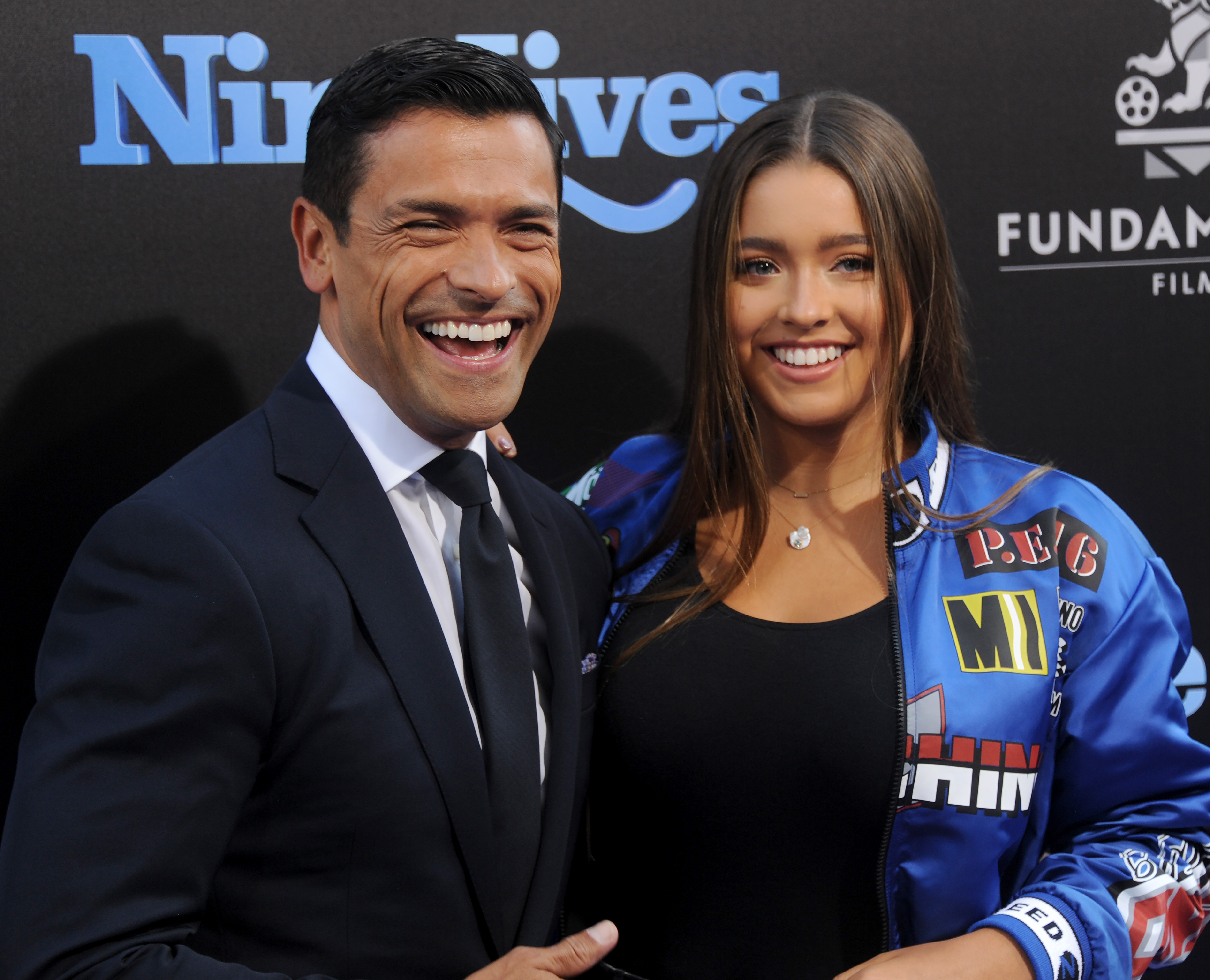 Mark Consuelos and Lola Consuelos pose together at the premiere of "Nine Lives" in 2016. The event captured Lola during her teenage years, long before many of her recent public appearances. | Source: Getty Images