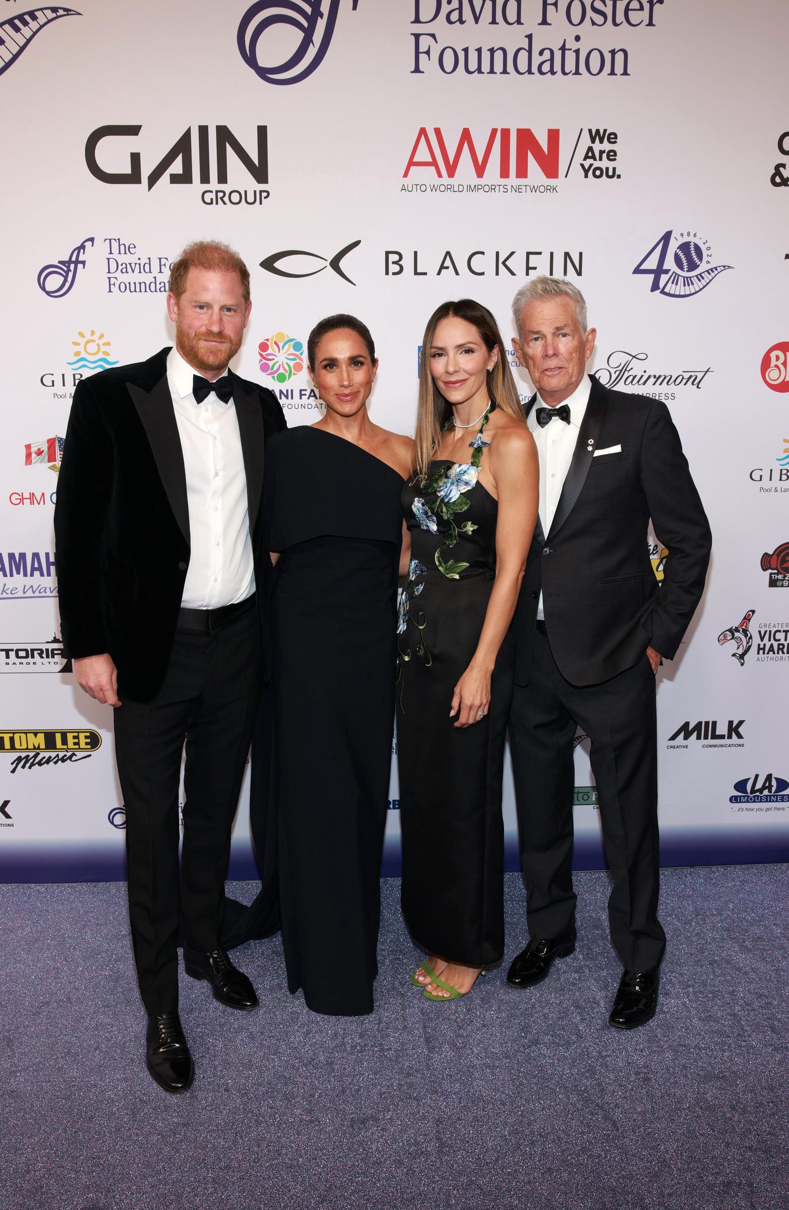 (L-R) Prince Harry, Duke of Sussex, Meghan, Duchess of Sussex, Katharine McPhee and David Foster attend the David Foster Foundation 40th Anniversary Celebration on August 7, 2026 in Victoria, British Columbia. | Source: Getty Images